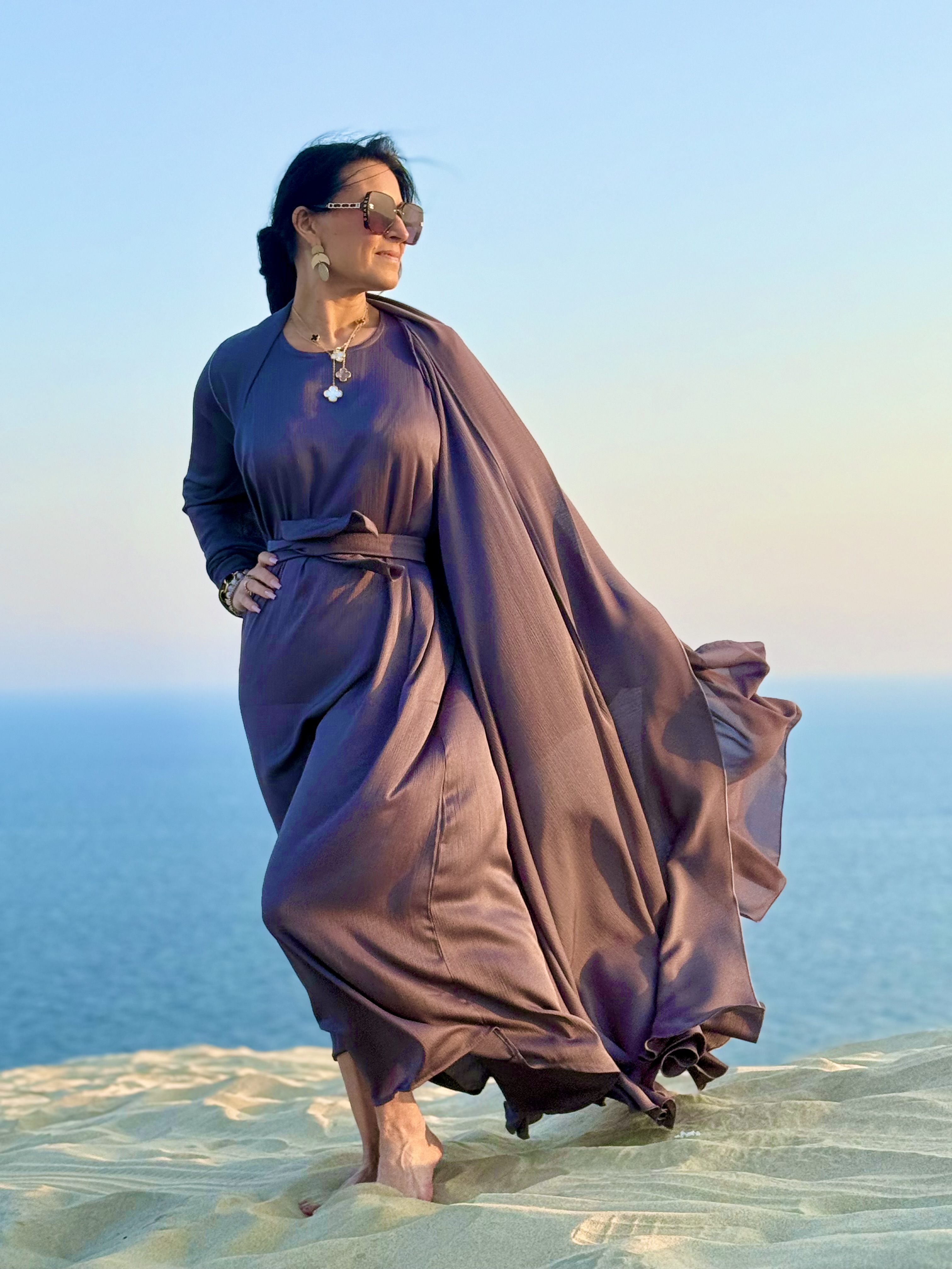 Client in long dress at golden desert sunset