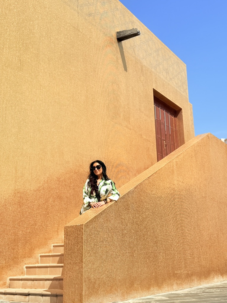 Client on Qatar golden staircase
